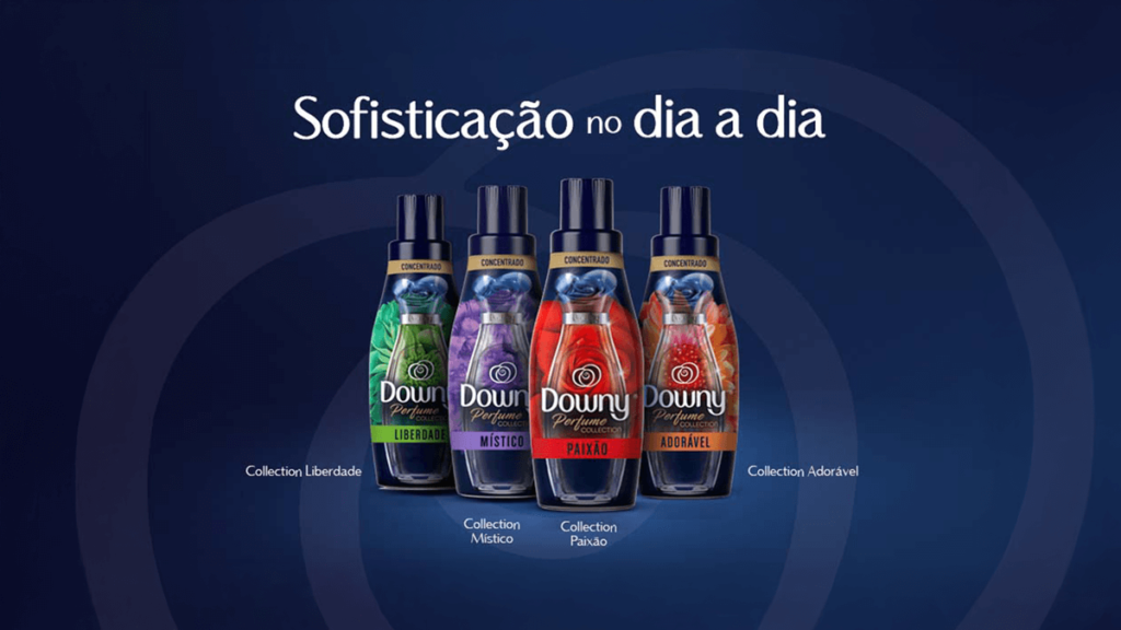 A imagem destaca a elegante linha Downy Perfume Collection, composta pelas variantes Liberdade, Místico, Paixão e Adorável. Cada amaciante é inspirado em fragrâncias sofisticadas que remetem aos grandes clássicos da perfumaria. Com embalagens luxuosas e fórmulas concentradas, eles oferecem uma experiência olfativa única, proporcionando roupas com perfumes intensos e duradouros. Ideal para quem procura o melhor amaciante Downy para elevar o cotidiano com um toque de sofisticação e aroma irresistível.